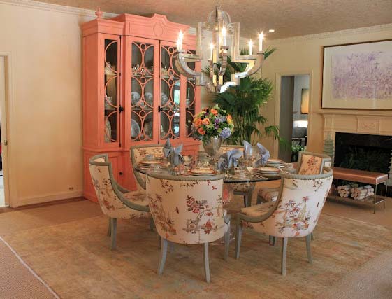 A punch of Grapefruit color on the breakfront is opposite the doors to the garden.